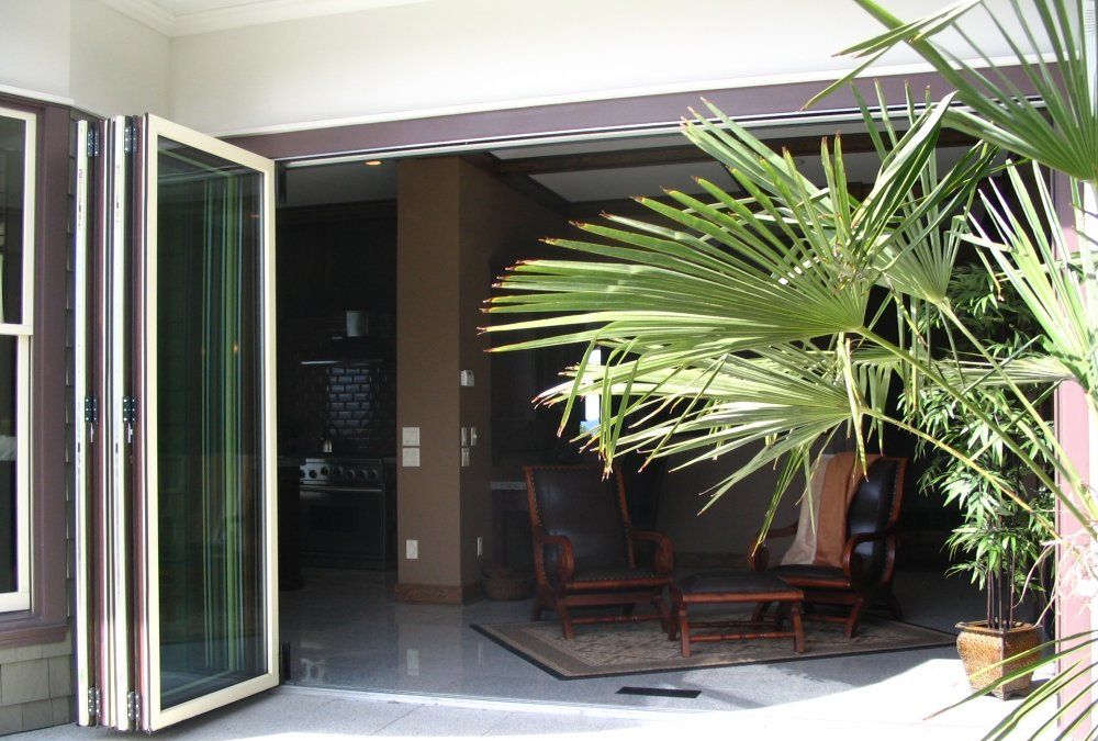 Glass Bi-Fold Doors - Aluminium and Wood - Moving Designs Limited - Example 3